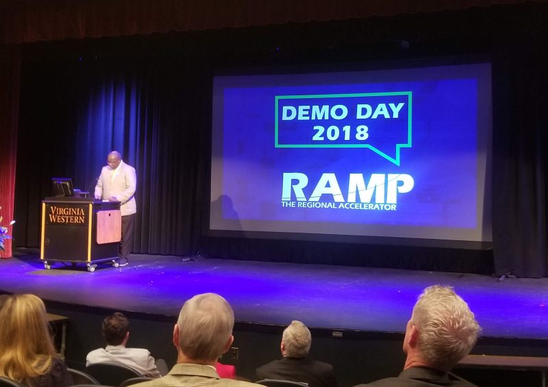Audience watches a presentation during RAMP Demo Day