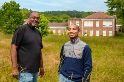 Chris Stephenson and Tiquan Goode, both of the nonprofit SPC4Life, stand along Academic Square on the former campus of St. Paul’s College in Lawrenceville, Virginia, about an hour southwest of Richmond. 