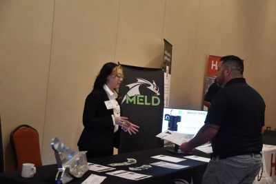 Photo of MELD representative and conference attendee.