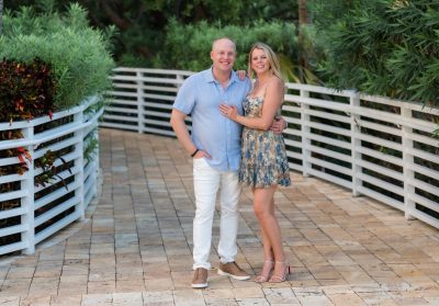 Two people standing together and posing for a photo